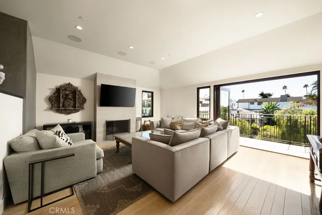 a living room with fireplace furniture and a flat screen tv