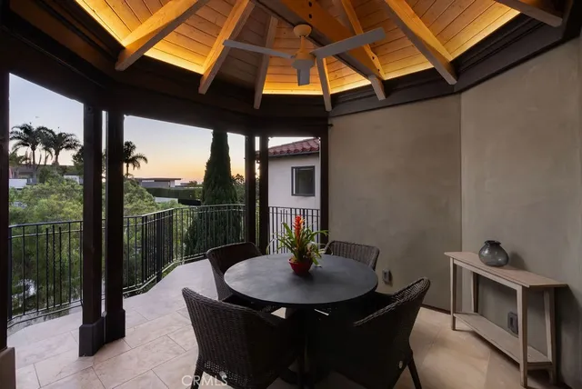 a backyard of a house with table and chairs