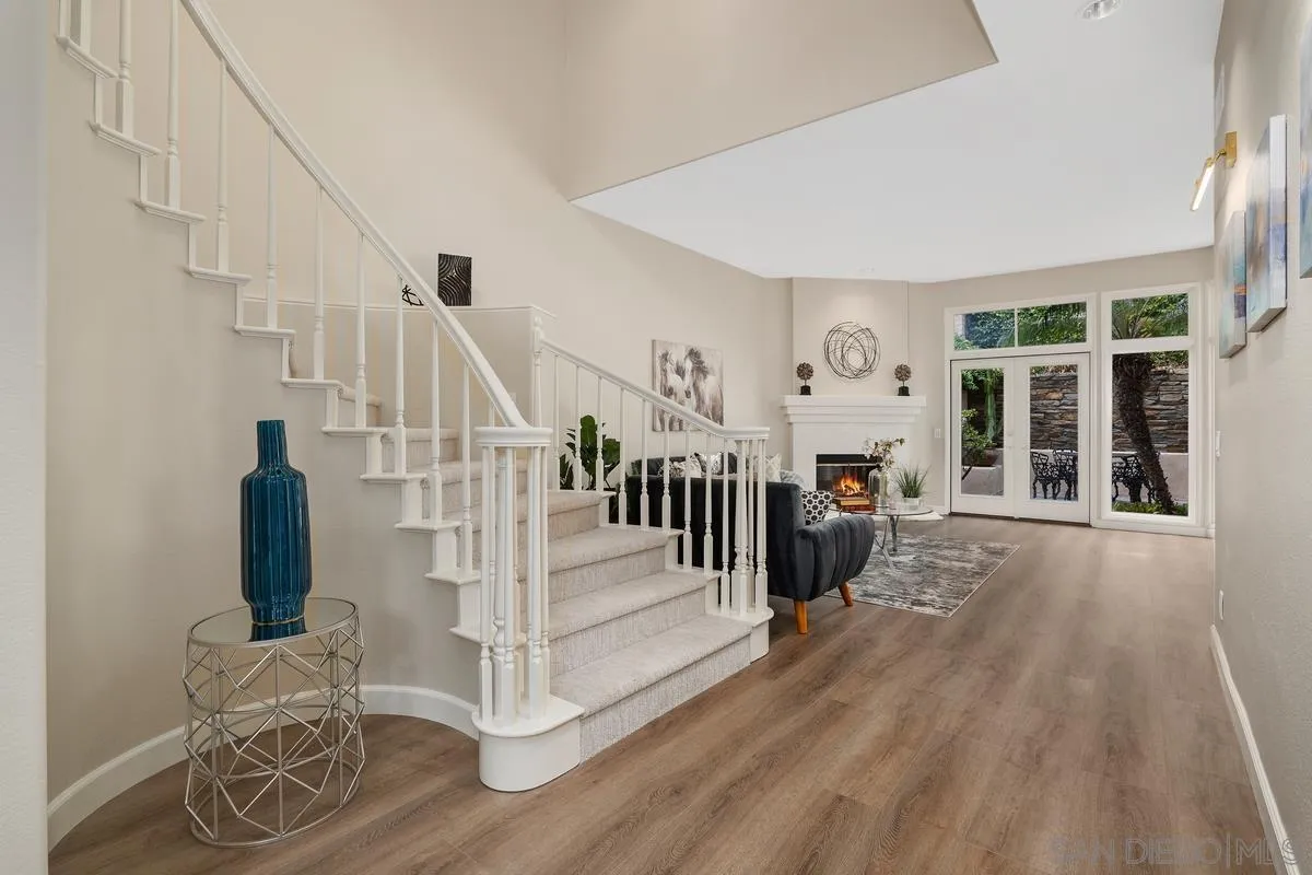 9605 Claiborne Square La Jolla, CA 92037 - Photo 11 of 34 a view of entryway and hall with wooden floor
