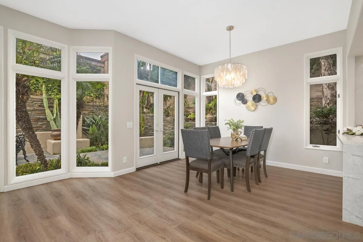9605 Claiborne Square La Jolla, CA 92037 - Photo 14 of 34 a view of a dining room with furniture window and outside view
