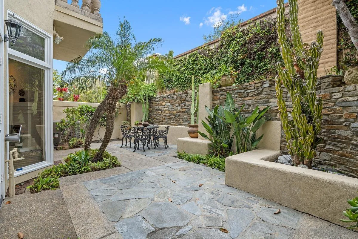 9605 Claiborne Square La Jolla, CA 92037 - Photo 15 of 34 a view of a garden with potted plants