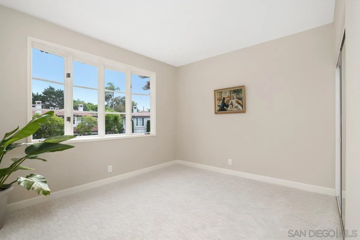 9605 Claiborne Square La Jolla, CA 92037 - Photo 30 of 34 an empty room with a window