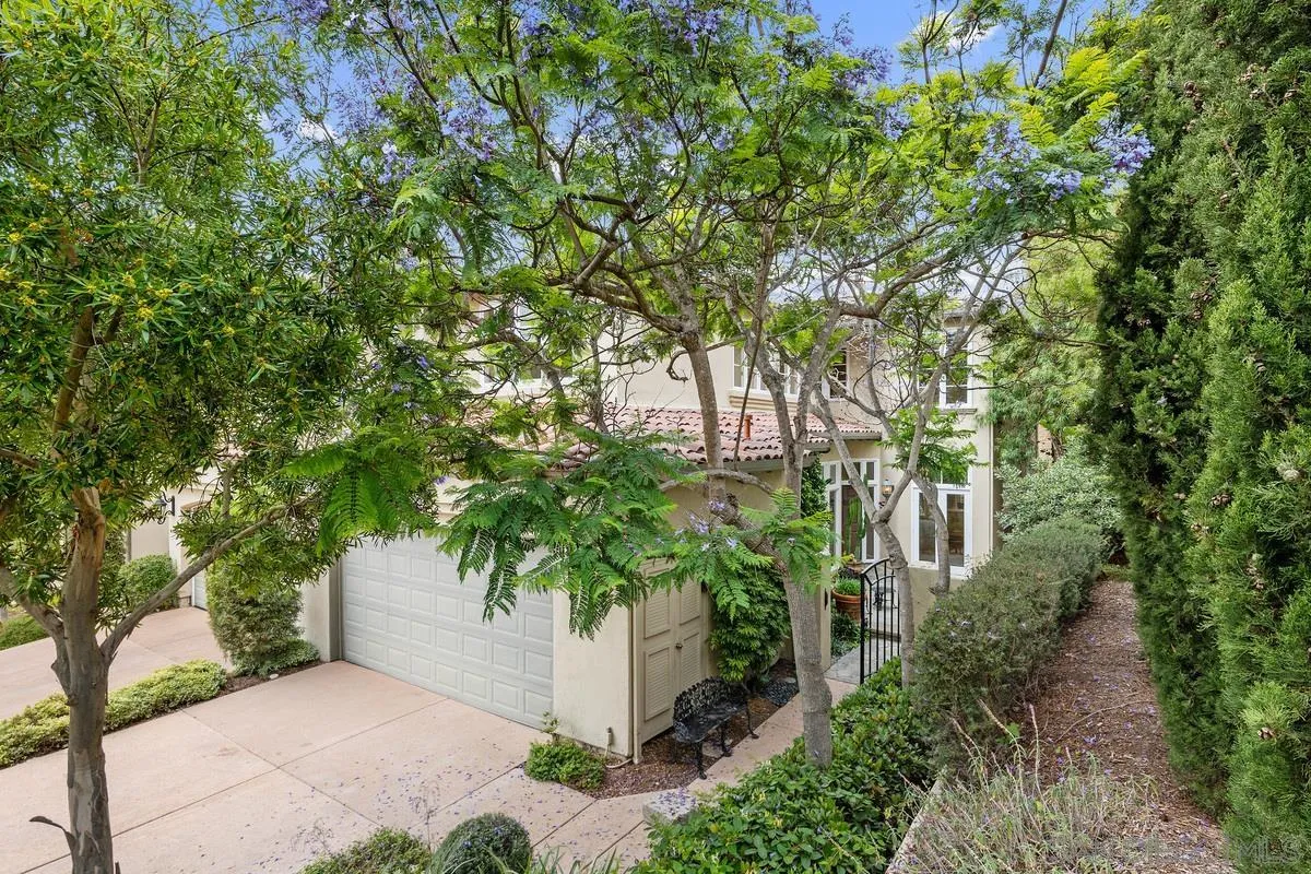 9605 Claiborne Square La Jolla, CA 92037 - Photo 3 of 34 a pathway of a house with a tree