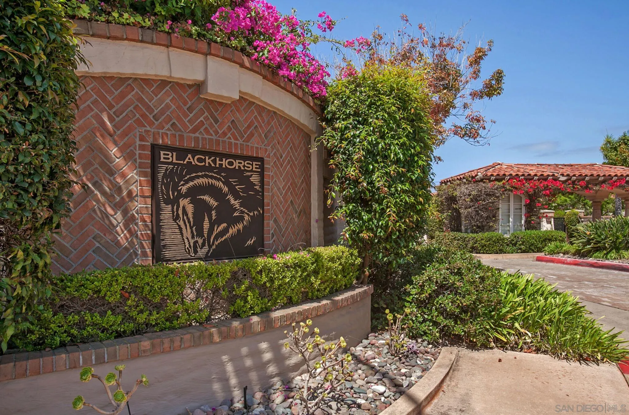 9605 Claiborne Square La Jolla, CA 92037 - Photo 32 of 34 a sign that is sitting in front of a house