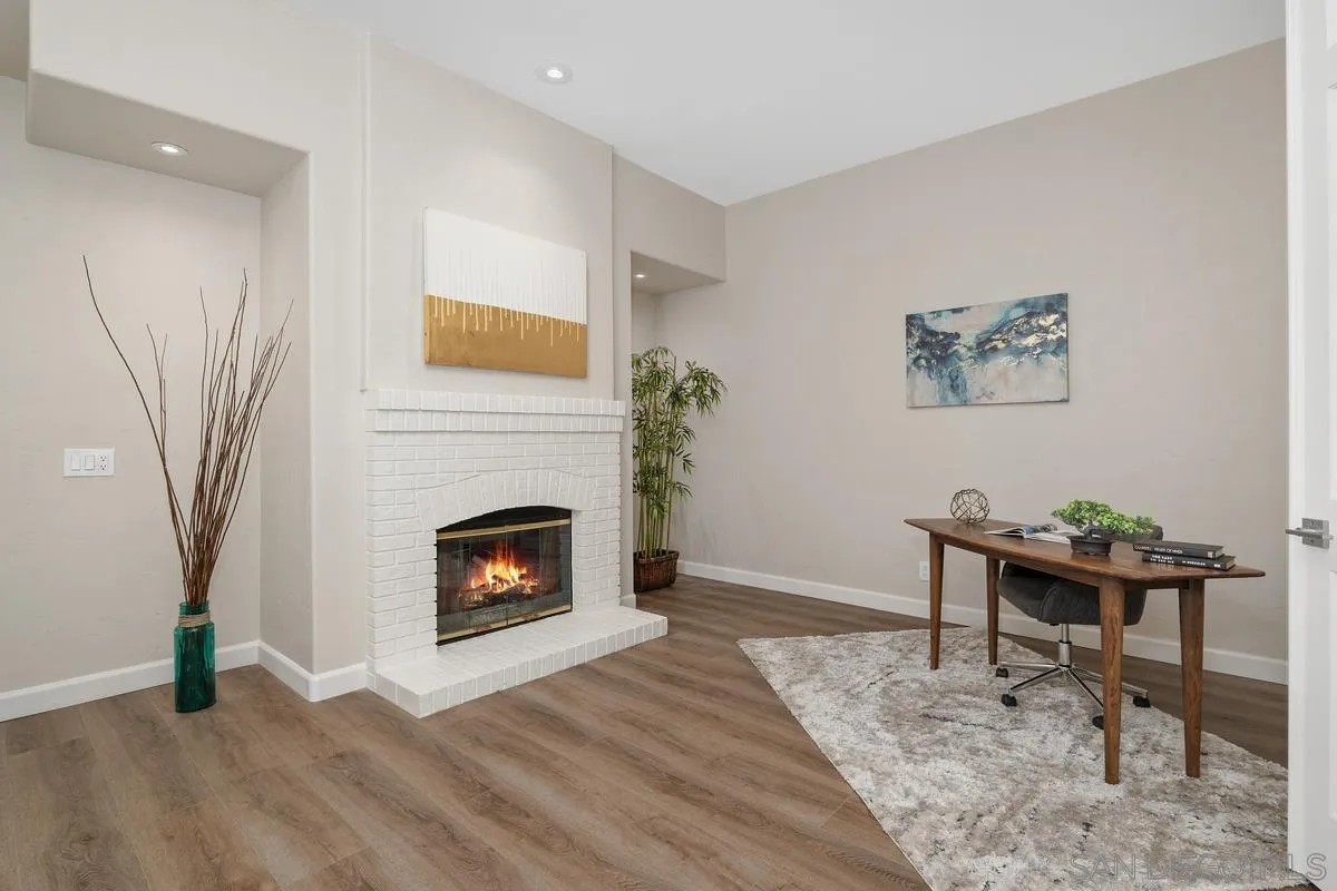9605 Claiborne Square La Jolla, CA 92037 - Photo 8 of 34 a living room with a fireplace