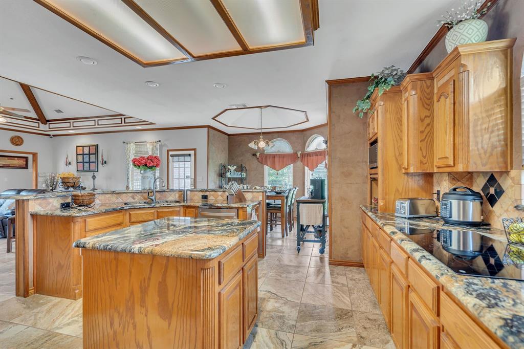 50 Buckingham Lane Allen, TX 75002 - Photo 20 of 39 a kitchen with stainless steel appliances granite countertop a sink stove and refrigerator