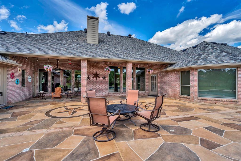 50 Buckingham Lane Allen, TX 75002 - Photo 35 of 39 a view of a dinning table and chairs in patio