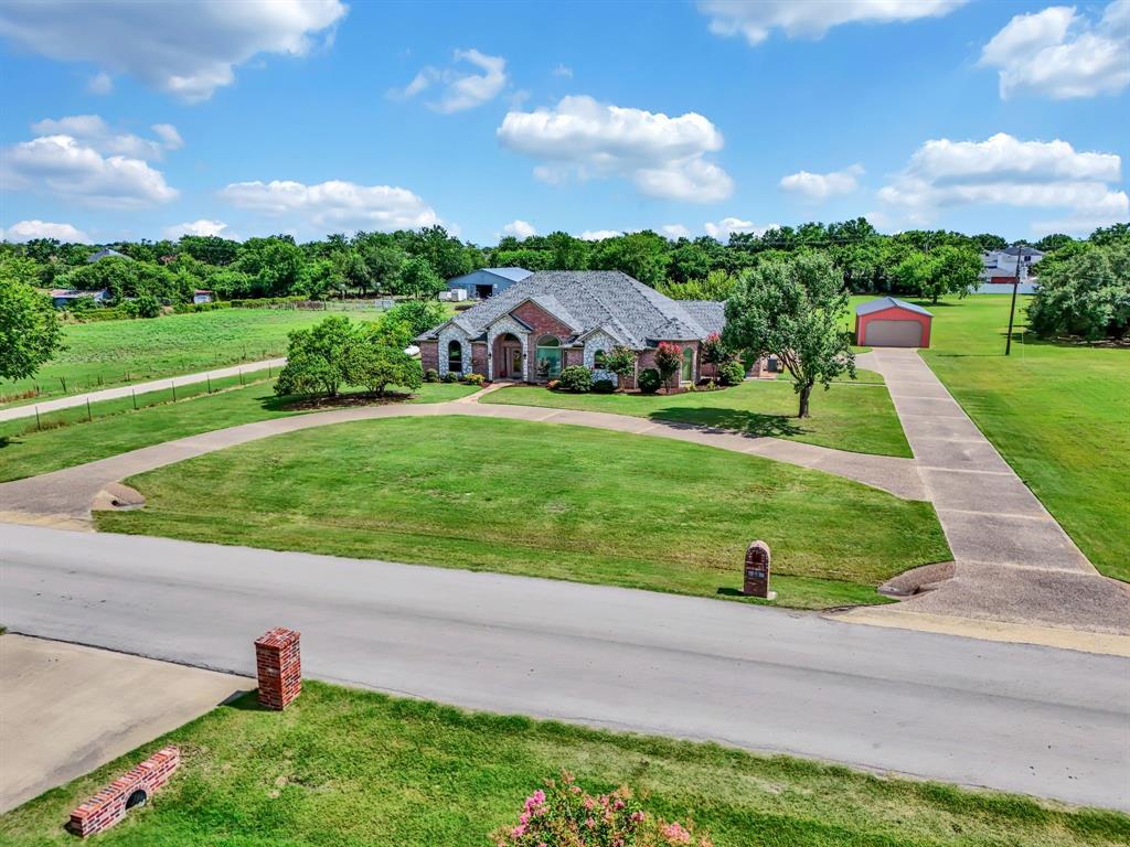 50 Buckingham Lane Allen, TX 75002 - Photo 4 of 39 a front view of a house with a yard and a garage