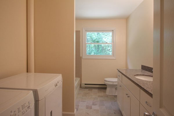 62 Adams Road Townsend, MA 01469 - Photo 9 of 16 a bathroom with a sink a toilet and a window