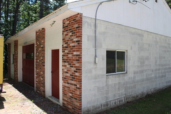 62 Adams Road Townsend, MA 01469 - Photo 10 of 16 a front view of a house with a yard