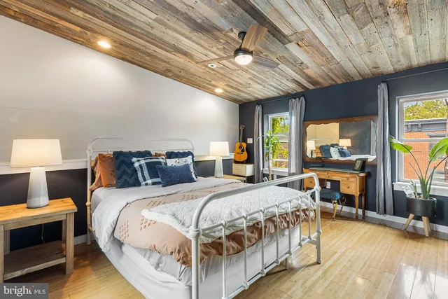 a bedroom with bed and a table