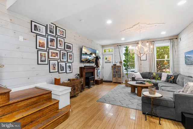 a living room with furniture or couch and a fireplace