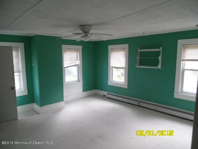 543 Brickyard Road Freehold, NJ 07728 - Photo 5 of 14 a view of empty room with window