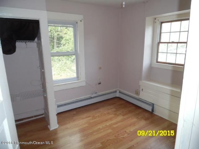 543 Brickyard Road Freehold, NJ 07728 - Photo 6 of 14 a view of a room with wooden floor and window