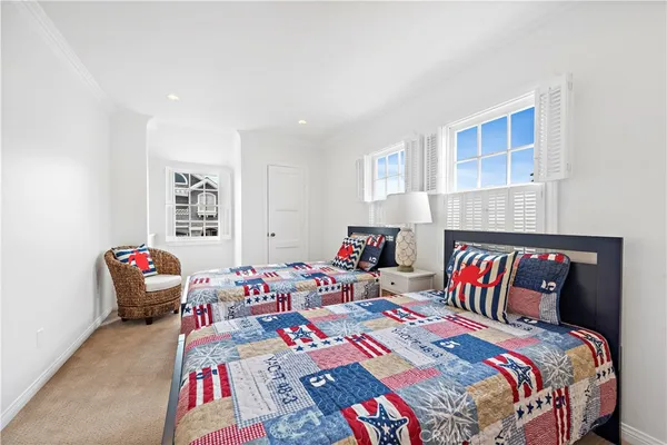 a bedroom with a bed and a couch