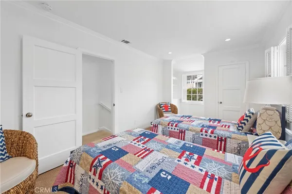 a bedroom with bed and a couch