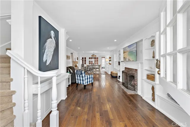 a living room with furniture and fireplace