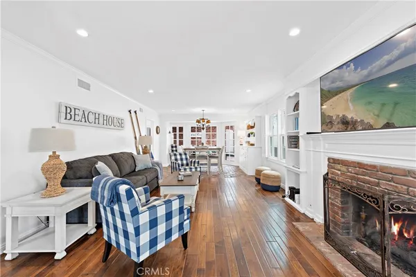 a living room with furniture fireplace and flat screen tv