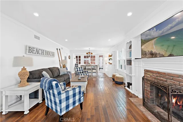 a living room with furniture fireplace and flat screen tv