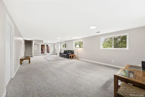 a view of a livingroom with furniture and windows