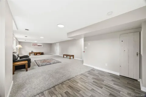 a bedroom with a bed and a view of kitchen