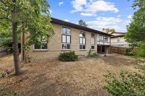 an aerial view of mountains residential house and green space