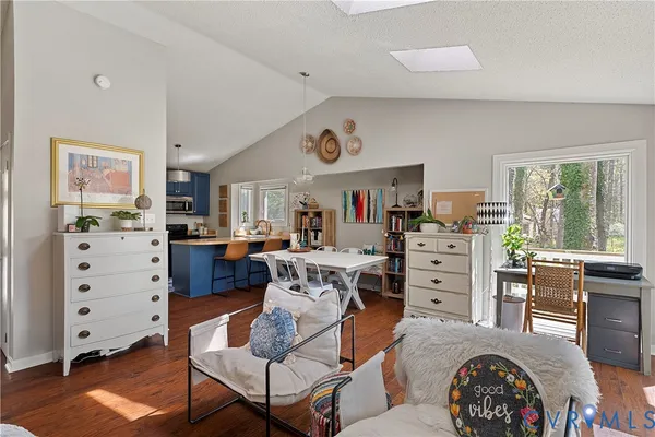a view of a dining room with furniture window and wooden floor