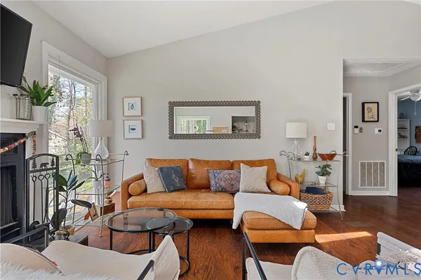 a view of kitchen with stainless steel appliances cabinets table and chairs