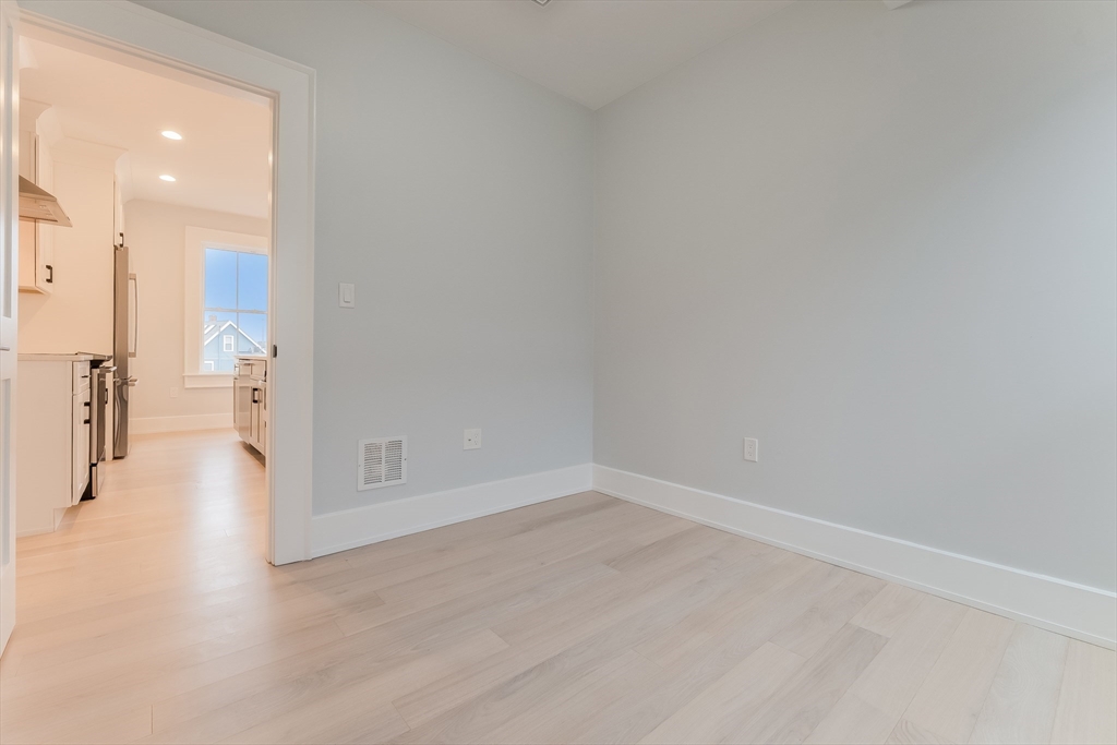 15 McKone Street, Unit 2 Boston, MA 02122 - Photo 16 of 24 a view of a hallway with wooden floor