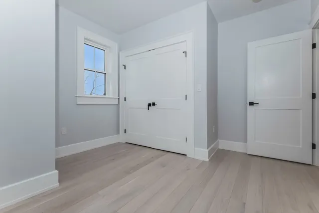 an empty room with wooden floor