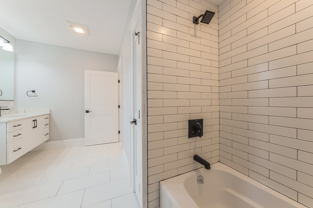 15 McKone Street, Unit 2 Boston, MA 02122 - Photo 23 of 24 a bathroom with a bathtub and shower