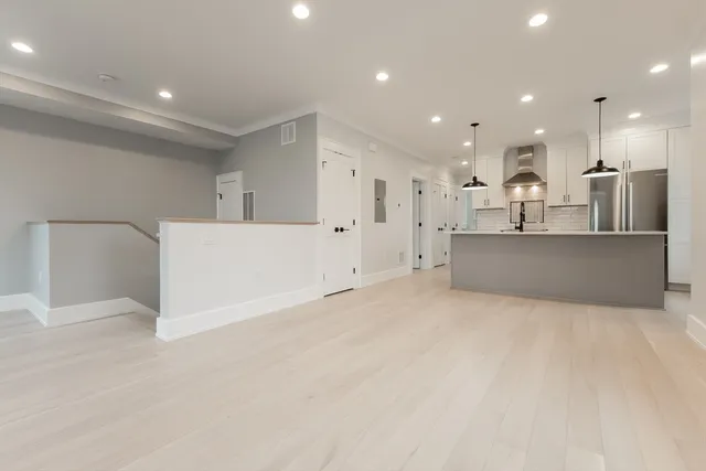a view of kitchen with refrigerator cabinets and a counter top space