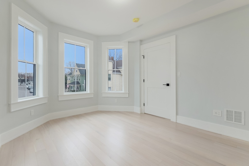 15 McKone Street, Unit 2 Boston, MA 02122 - Photo 10 of 24 a view of an empty room with a window