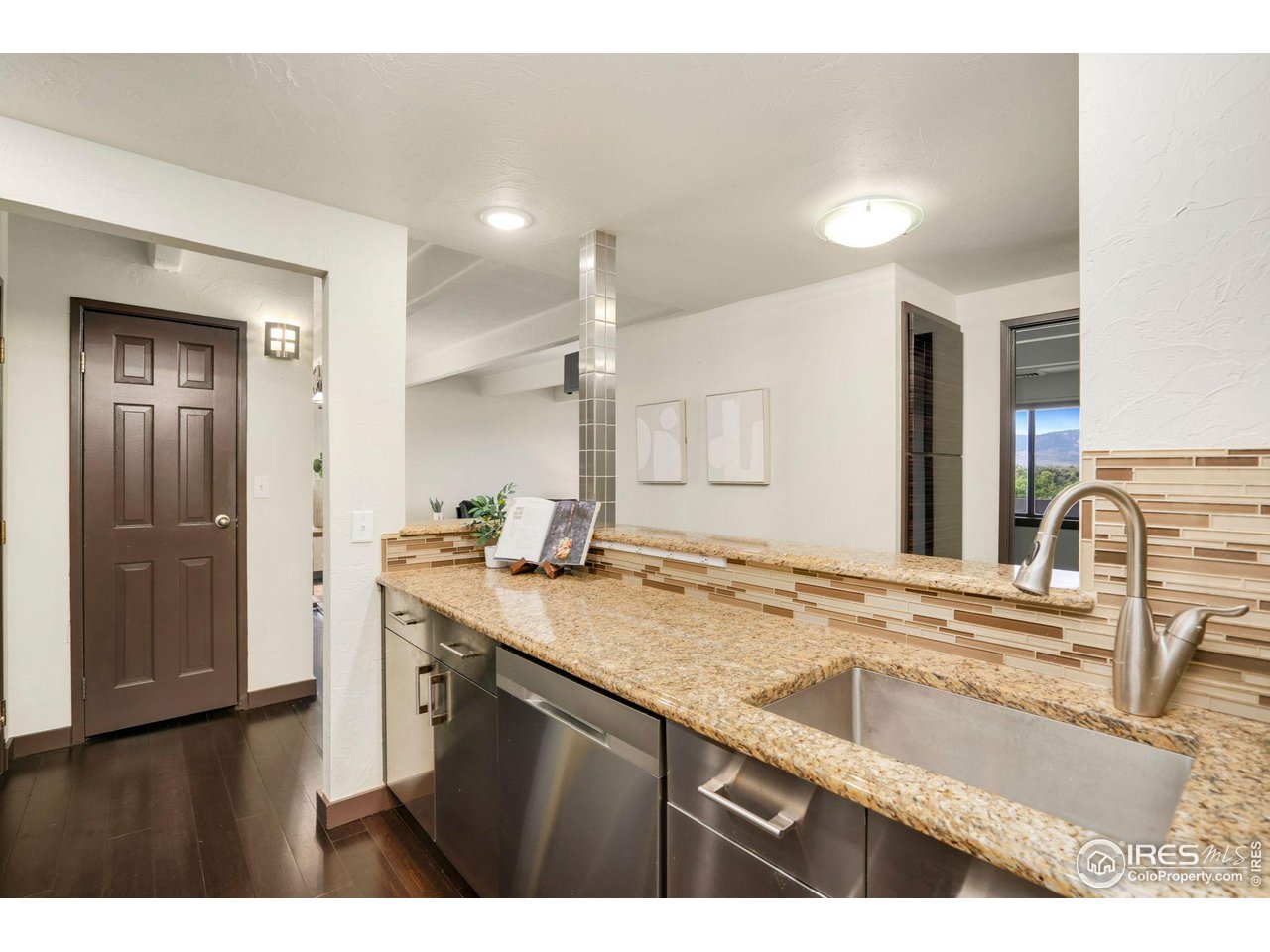 415 South Howes Street, Unit 910 Fort Collins, CO 80521 - Photo 13 of 28 a view of a kitchen counter space and a sink