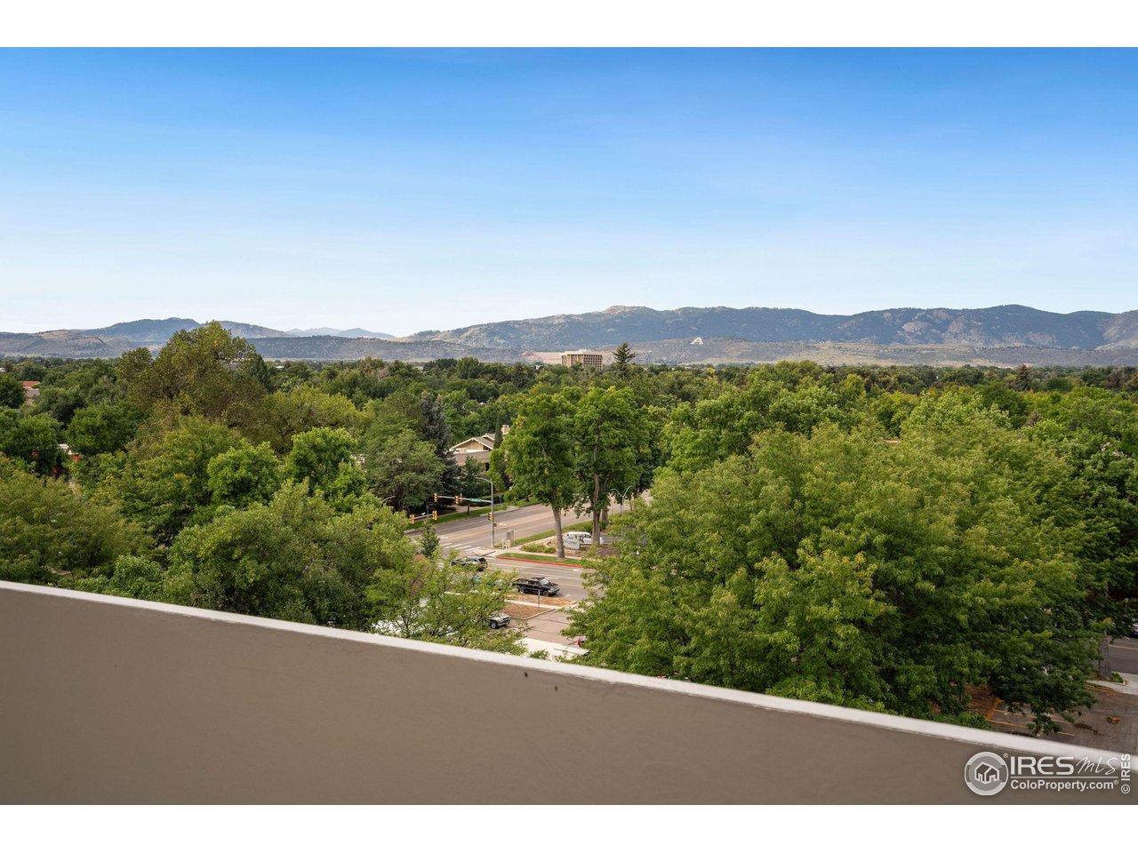 415 South Howes Street, Unit 910 Fort Collins, CO 80521 - Photo 27 of 28 a view of a city with lush green forest