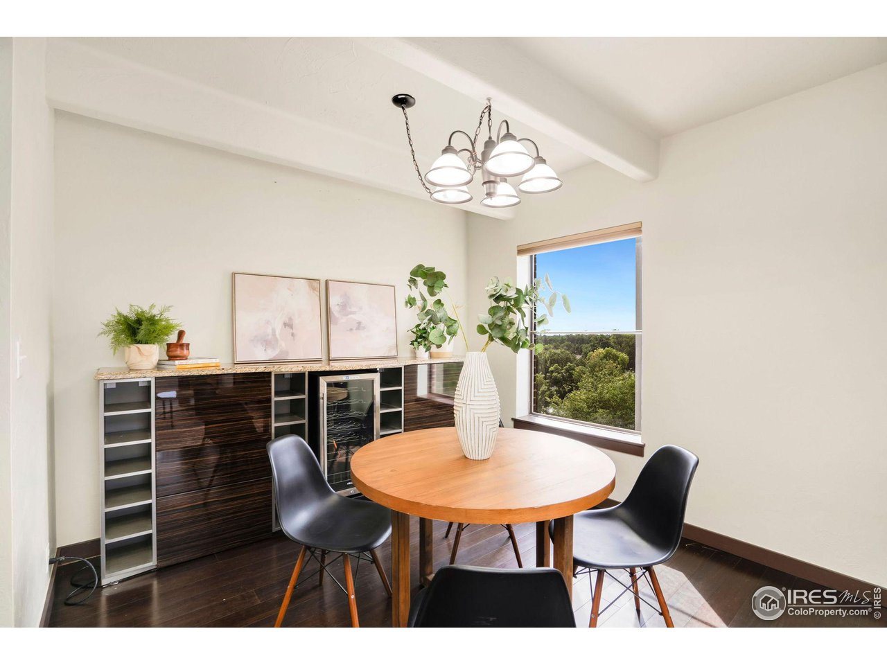 415 South Howes Street, Unit 910 Fort Collins, CO 80521 - Photo 4 of 28 a view of a dining room with furniture and wooden floor