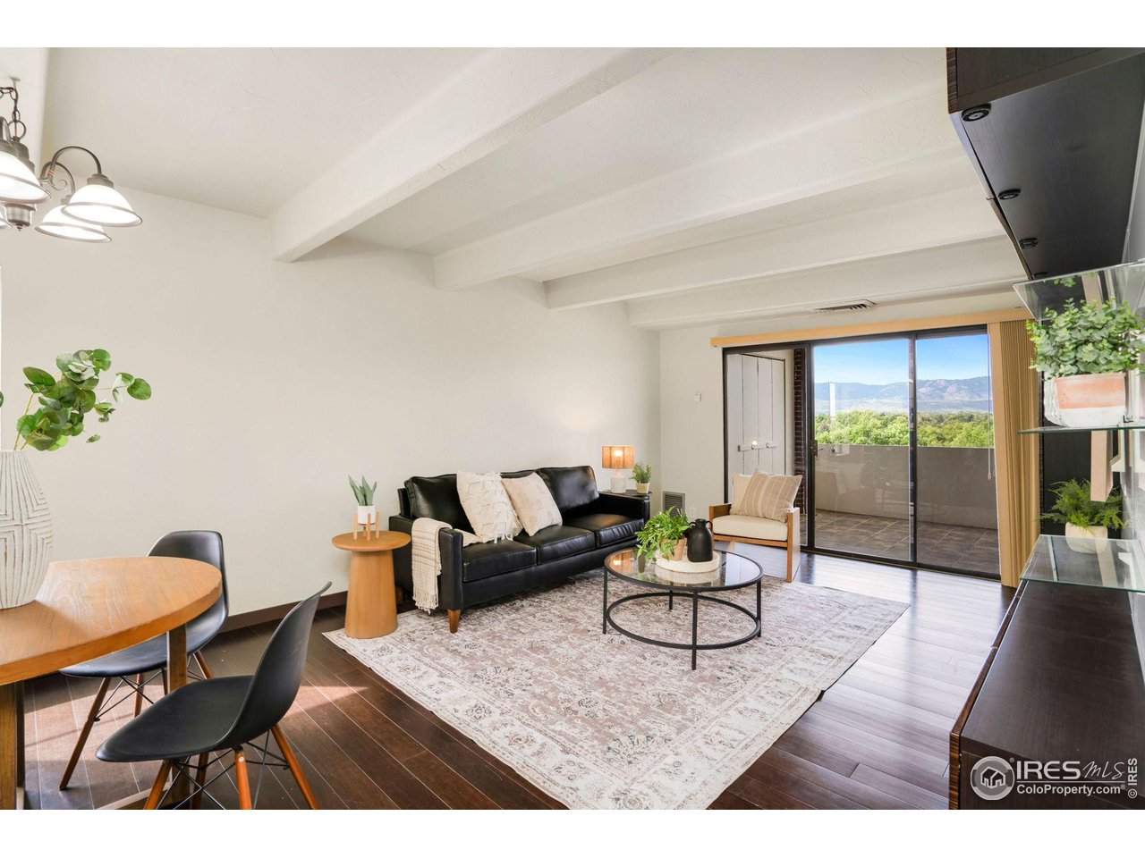 415 South Howes Street, Unit 910 Fort Collins, CO 80521 - Photo 5 of 28 a living room with furniture and a floor to ceiling window