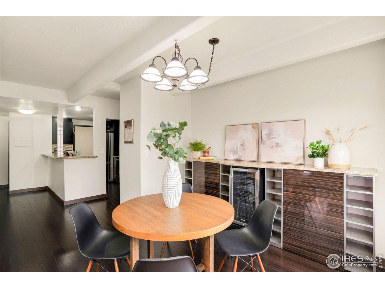 415 South Howes Street, Unit 910 Fort Collins, CO 80521 - Photo 8 of 28 a view of a dining room with furniture and wooden floor