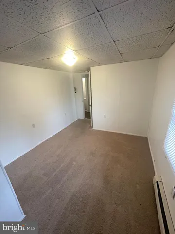 a view of a room with window and stairs