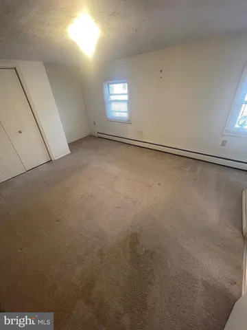 an empty room with a bench