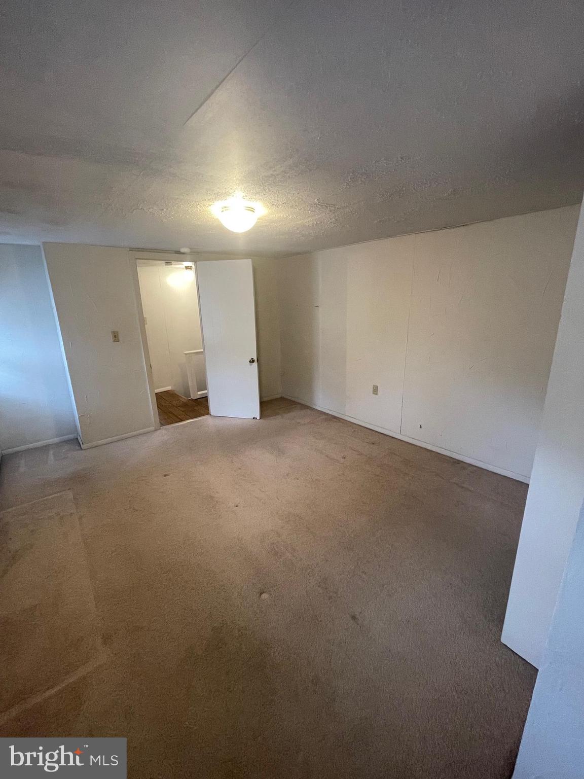 425 Rear Seventh Street New Cumberland, PA 17070 - Photo 17 of 23 an empty room with a bench