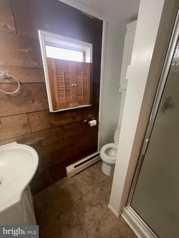 a bathroom with a toilet and a sink