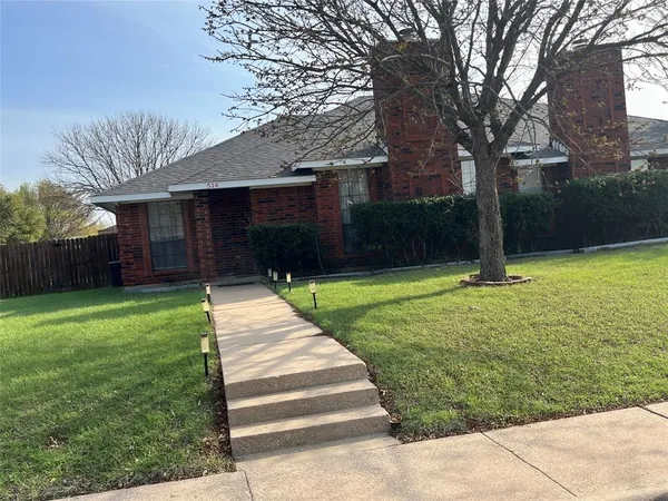 a house view with a garden space