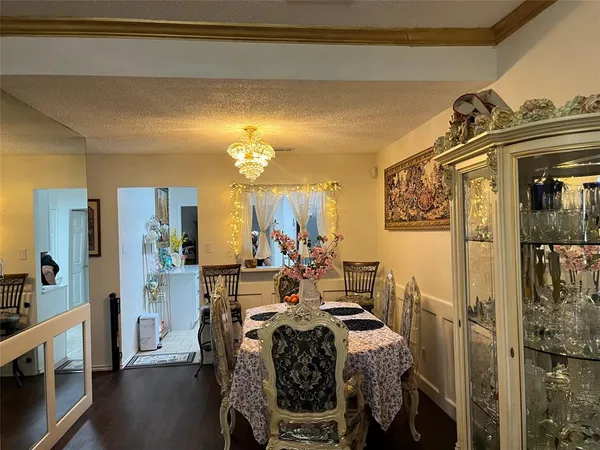 a view of a balcony dining table and chairs