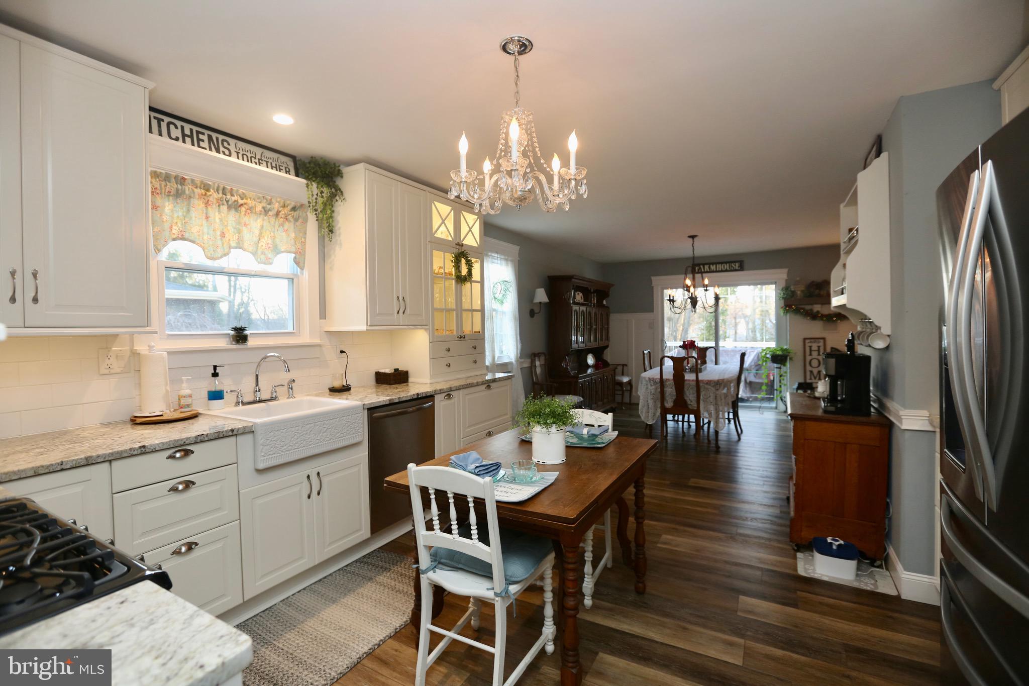 33 Pembrook Road Turnersville, NJ 08012 - Photo 14 of 43 a view of a dining room with furniture and a chandelier