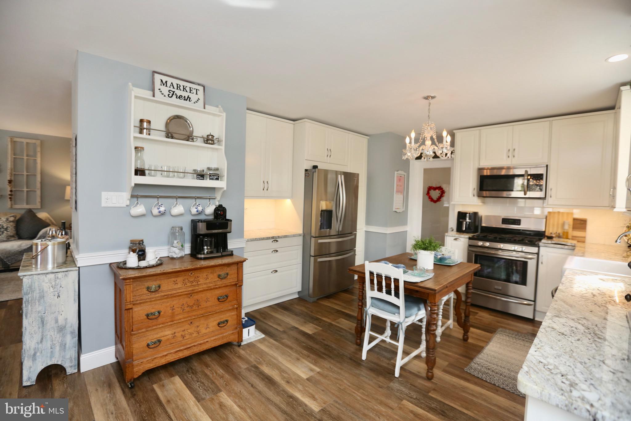 33 Pembrook Road Turnersville, NJ 08012 - Photo 15 of 43 a kitchen with stainless steel appliances kitchen island granite countertop a refrigerator and microwave