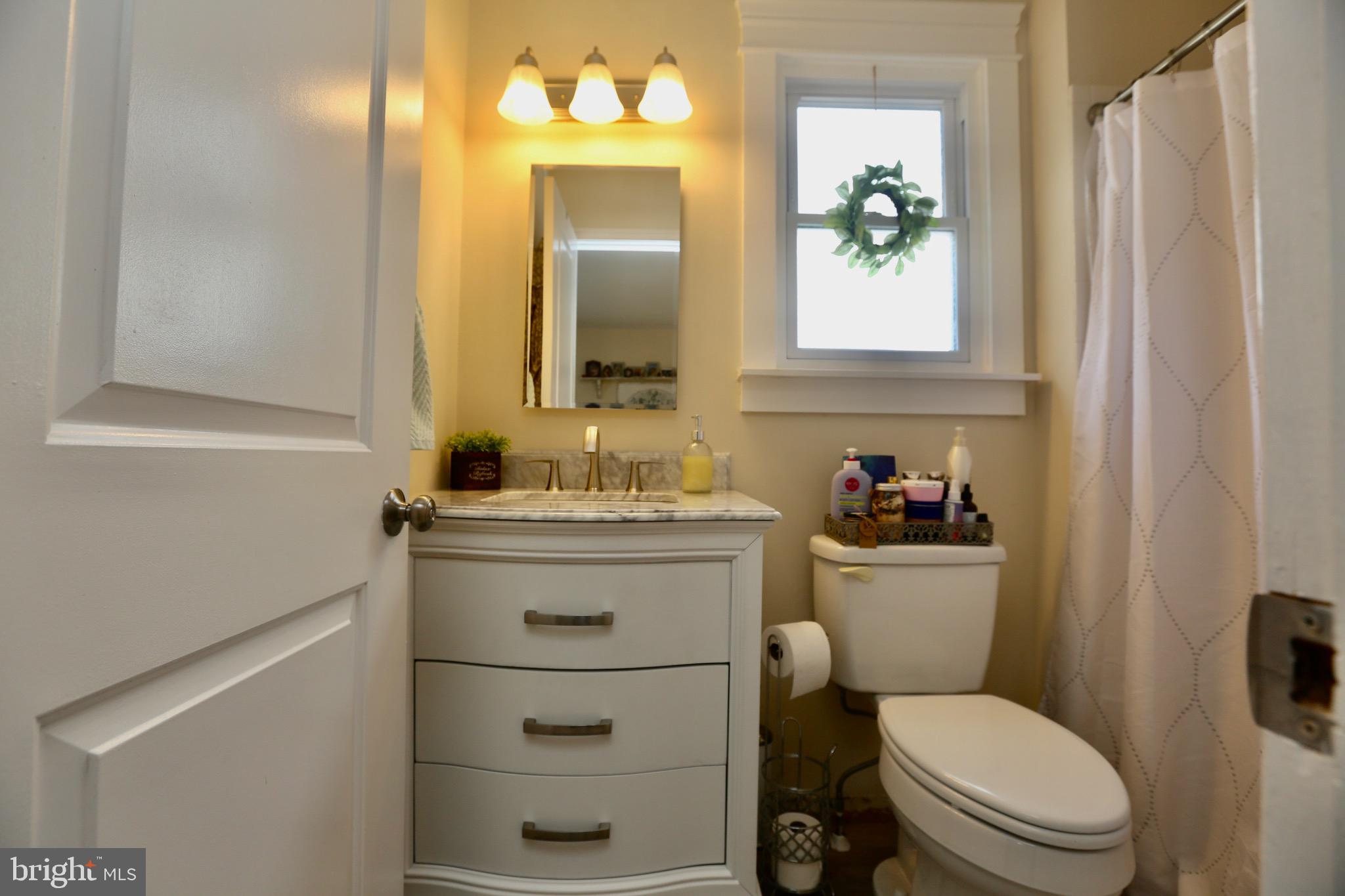 33 Pembrook Road Turnersville, NJ 08012 - Photo 20 of 43 a bathroom with a toilet sink vanity and mirror
