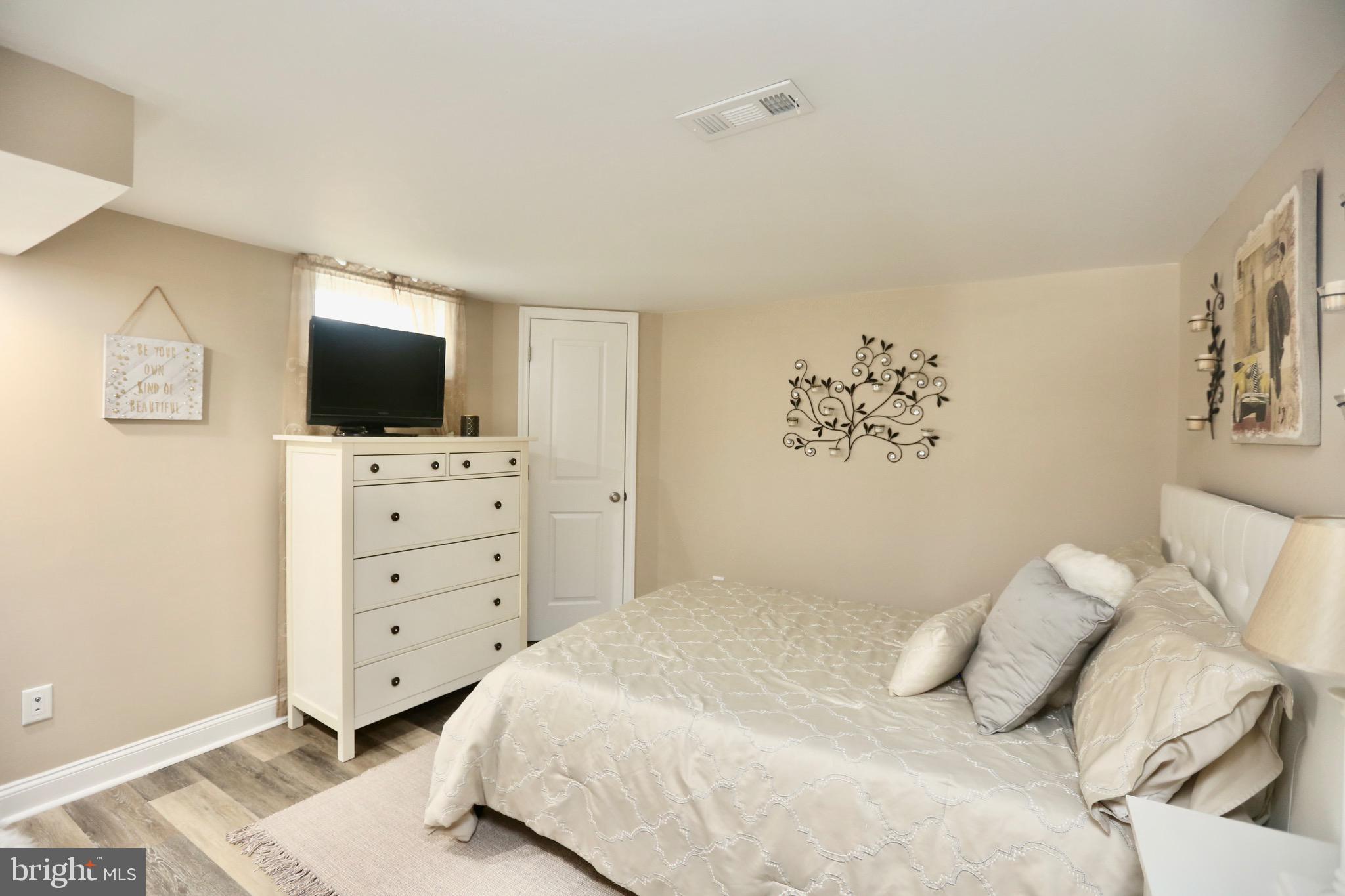 33 Pembrook Road Turnersville, NJ 08012 - Photo 34 of 43 a bedroom with a bed and flat screen tv