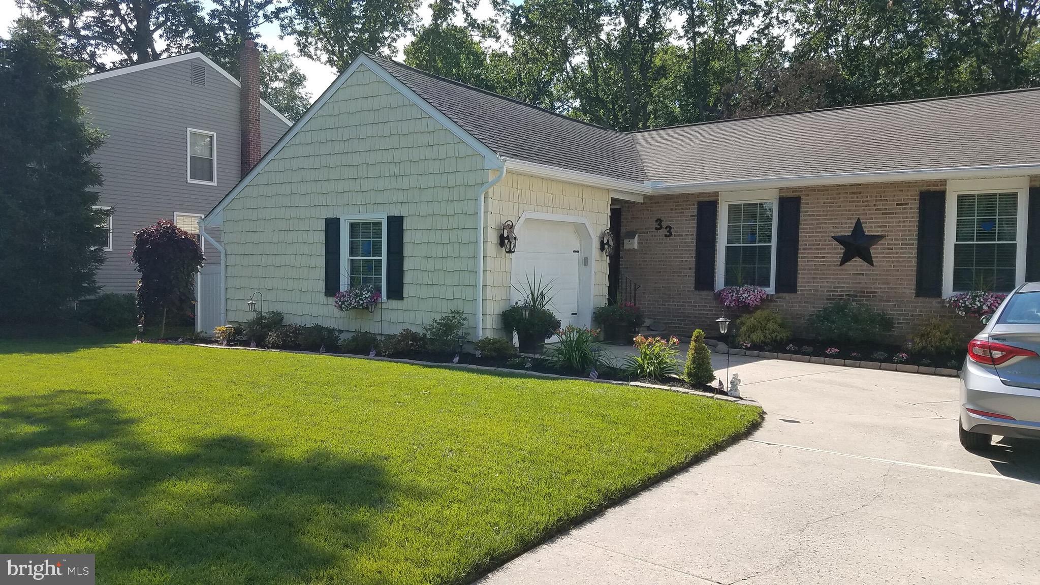 33 Pembrook Road Turnersville, NJ 08012 - Photo 41 of 43 a view of a house with a yard and potted plants