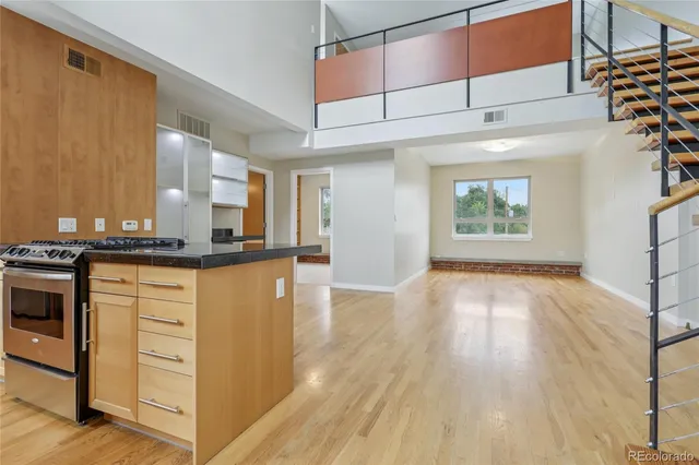 a view of kitchen with cabinets and wooden floor